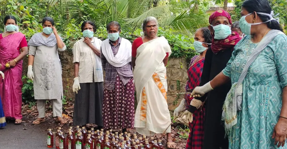 The 66 bottles of IMFL hidden inside bushes near Thiruvali recovered by women workers under the rural employment guarantee scheme. Photo: Special Arrangement