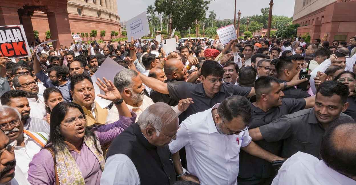 Opposition and ruling party MPs clash during their protests, amid the ongoing Monsoon session of Parliament, in New Delhi, Thursday, July 23, 2026. Photo: PTI