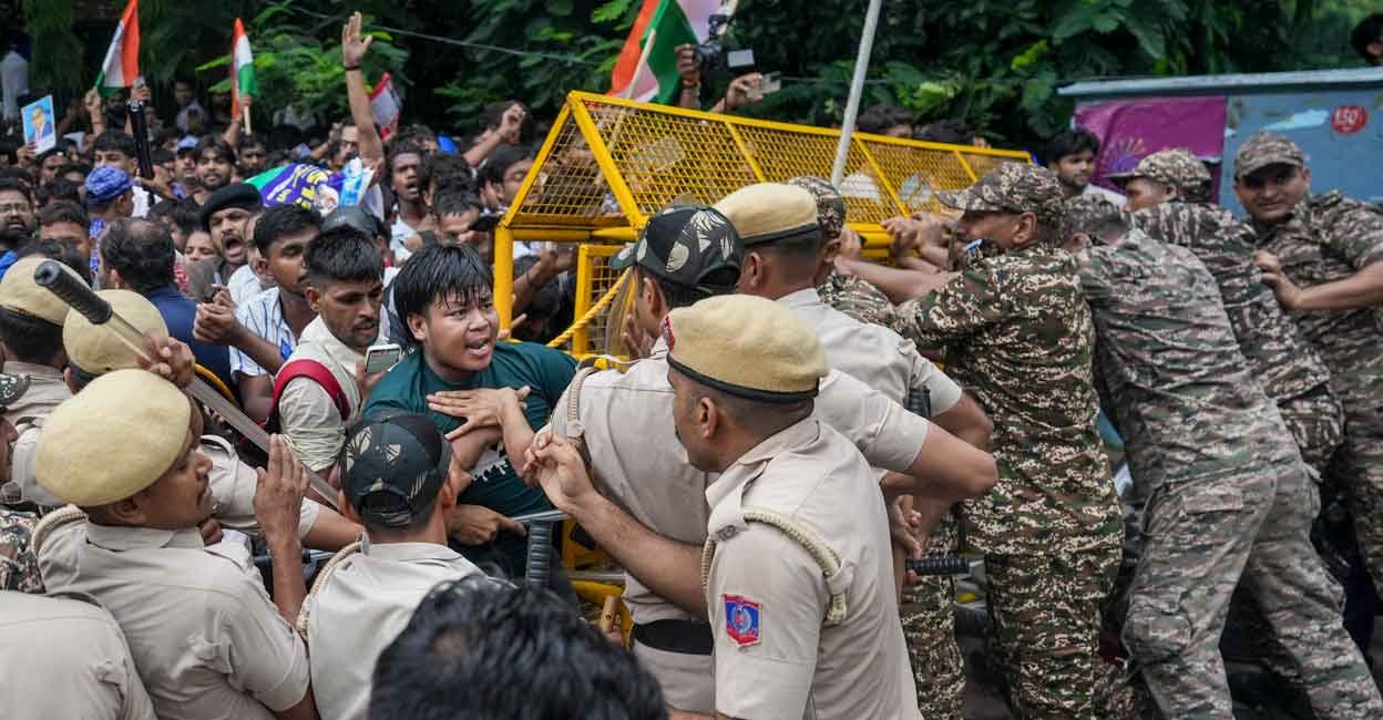 Security personnel stop Cockroach Janata Party (CJP) supporters as they raise slogans near Jantar Mantar ahead of a protest march, in New Delhi, Monday, July 20, 2026. Photo: PTI