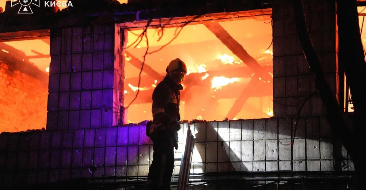 A firefighter stands near a building that was hit during Russian attacks in Ukraine. Photo: Volodymyr Zelenskyy/X